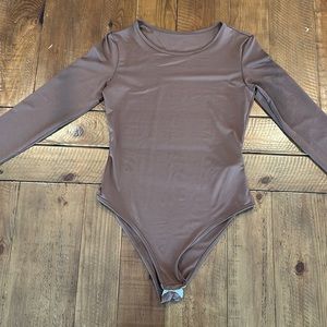 Brown body suit, size medium unworn, but with no tags